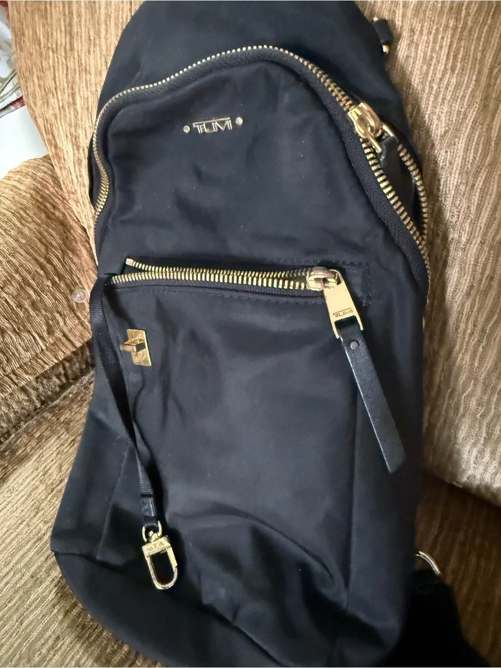 Tumi Black Sling Belt Bag with Gold Hardware